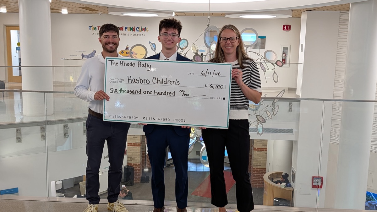 Jack presenting the $6,100 check to Hasbro Children's Hospital