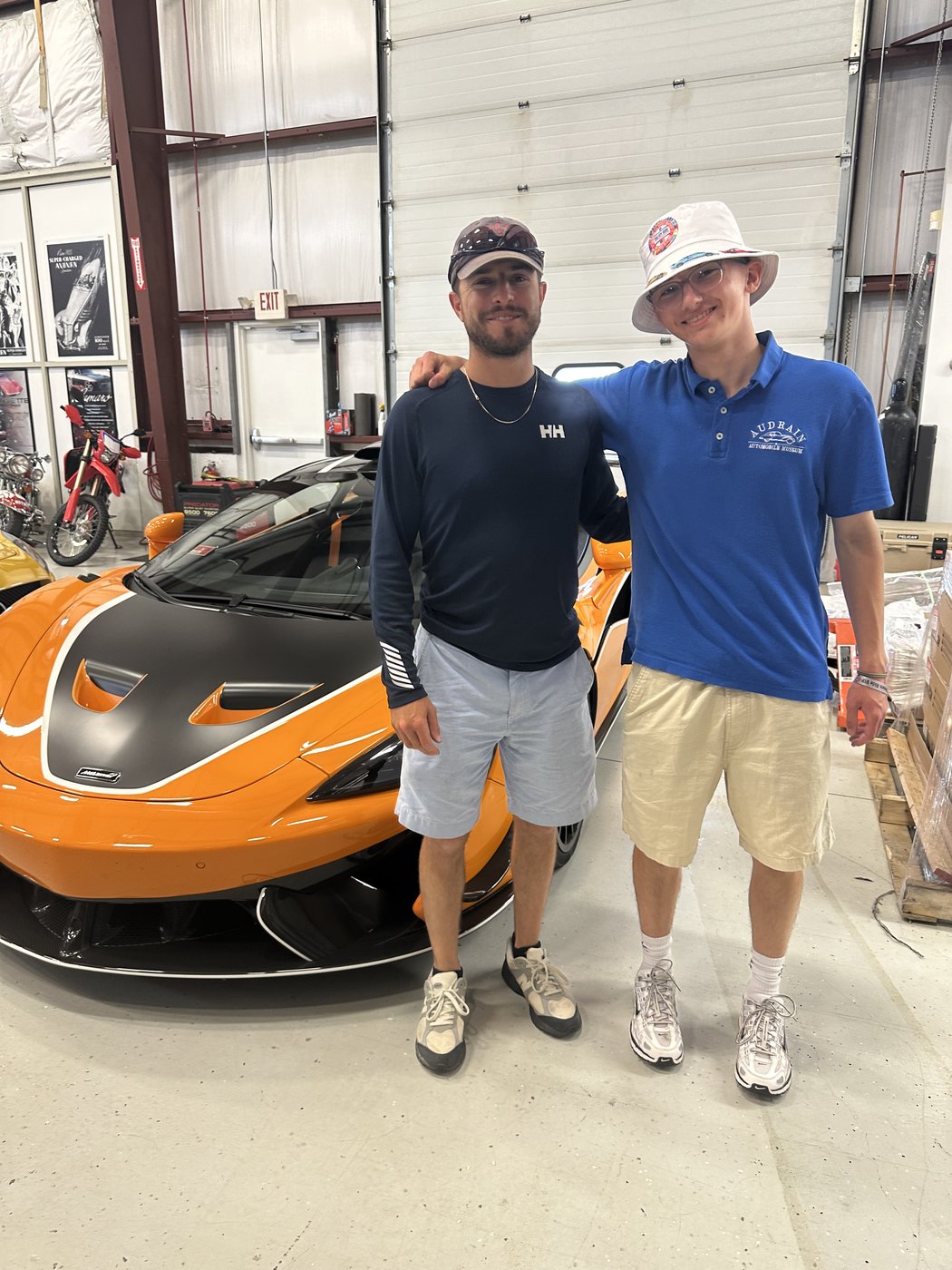 Jack Masse and Ben Chester in front of a McLaren