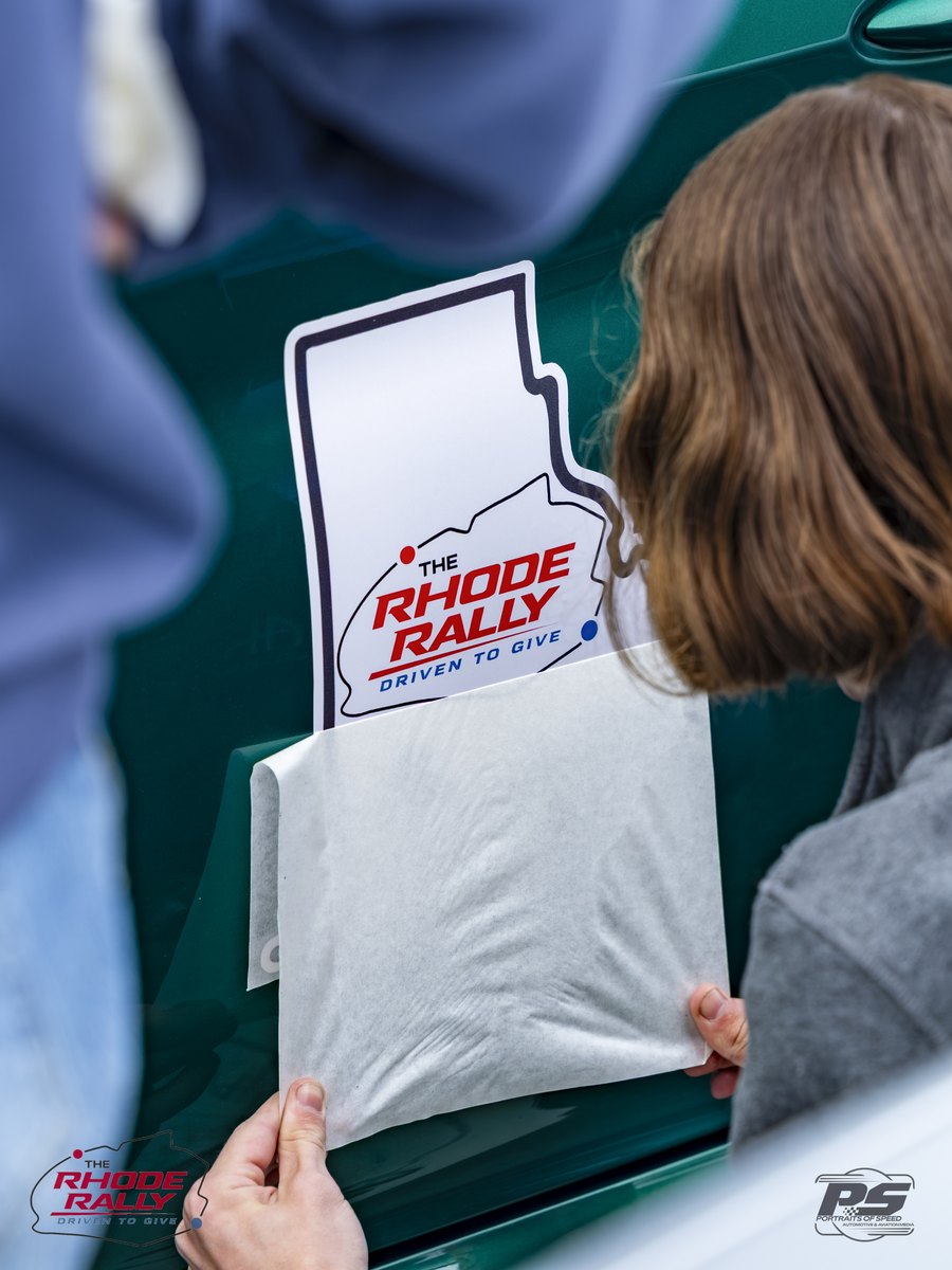 Applying a Rhode Rally decal on the morning of the drive
