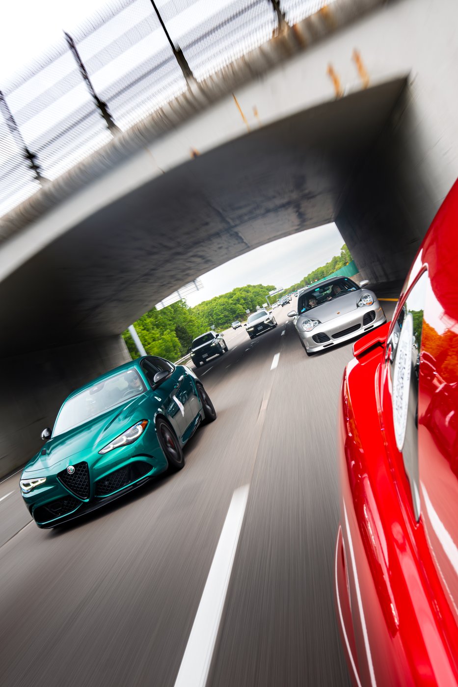 Convoy passing under a highway overpass